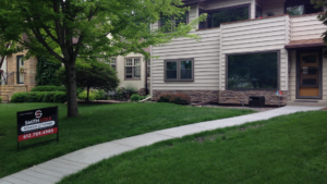 Removal of existing brick, Repair to sheathing/studs from moisture intrusion behind Brick, Installation of new flashings and Stone.